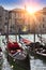 A sunset over the channel and gondolas, Venice, Italy