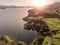 Sunset over Connemara, Lake Corrib, county Galway, warm tones, sun haze. rural landscape