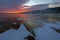 Sunset over crack Baikal ice