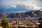 Sunset over Cusco, Peru, with storm clouds