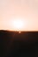 Sunset over the desert: A breathtaking display of golden hues transforms the landscape, evoking a sense of serenity and