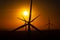 Sunset over an eolian wind farm with amazing sky color. Alternative eco energy