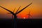 Sunset over an eolian wind farm with amazing sky color. Alternative eco energy