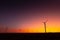 Sunset over an eolian wind farm with amazing sky color. Alternative eco energy