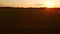 Sunset over farm fields. Aerial rural landscape.