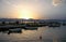 Sunset over fishing boats in the harbor at Nafplio in Greece