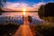 Sunset over the fishing pier at the lake in Finland