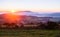 Sunset over foggy farmland in England