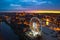 Sunset over the Gdansk city with illuminated ferris wheel, Poland