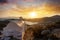 Sunset over the Greek island of Ios with a orthodox church in front on the Cyclades, Greece