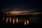 Sunset over Guadalquivir river.Triana neighborhood with bridge of Isabel II. Beautiful sunset on the bank of Canal de Alfonso-XIII