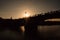 Sunset over Guadalquivir river.Triana neighborhood with bridge of Isabel II. Beautiful sunset on the bank of Canal de Alfonso-XIII