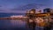 Sunset over the High Rise Buildings, Float Plane Terminal and Cruise Ship Terminal along the shore of Coal Harbor, Vancouver