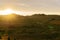 Sunset over hilly fields in summer in Bashkiria