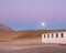 Sunset over a home in bolivian mountain range