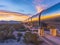 Sunset Over Industrial Pipeline in Desert Landscape