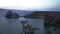 Sunset over Lake Baikal with Shaman rock in the background, Olkhon Island.