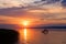 Sunset over Lake Balaton with anglers` silhouettes in Hungary