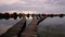 Sunset over lake Bokod with wooden pier and floating houses, Hungary