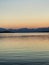 Sunset over Lake Tekapo, New Zealand, painting the sky with vivid colors and serene reflections