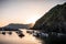 Sunset over Liguarian sea. Boats anchored in Vernazza. View of nature in Cinque Terre