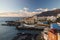 Sunset over Los Gigantes cliffs and resorts of Puerto Santiago