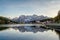 Sunset over Misurina Lake with sky reflection in calm water. View on the majestic Dolomites Alp Mountains, National Park Tre Cime