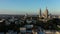 Sunset over Montmartre hill with Basilique du Sacre-Coeur in Paris aerial