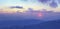 Sunset over mountain top, winter mountain range panorama