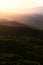 Sunset over mountains. Time-lapse of sun setting over the mountains. Sequence of clouds forming and dissipating near sunset