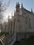 Sunset over neo romantic chaple in the woods
