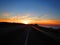 Sunset over ocean highway
