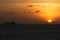 Sunset over the ocean and a ship in Vung Tau, Vietnam