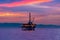 Sunset Over Offshore Petroleum Platform in Sea