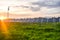 Sunset over a photovoltaic power plant with photovoltaic modules for renewable energy on the field. Solar power generation