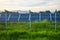 Sunset over a photovoltaic power plant with photovoltaic modules for renewable energy on the field. Solar power generation