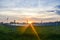 Sunset over a photovoltaic power plant with photovoltaic modules for renewable energy on the field. Solar power generation