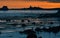 sunset over Piedras Blancas lighthouse and Big Sur rugged coastline