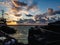 Sunset over the port with tugboats.