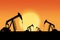 Sunset Over Pumpjacks Silhouette With Copy Space