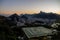 Sunset over Rio de Janeiro with helicopter helipad in foreground and mountains and hills in background during dusk in Rio, Brazil