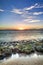 Sunset over rocky coastline