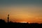 Sunset over the roof tops of the city & also showing the column of Place des Quinconces,  Bordeaux, France