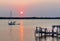 Sunset over a sailboat crossing Indian river