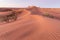 Sunset over the sand dunes in the desert, California USA Discovery and adventure travel concept. Sunlight over the desert dunes.