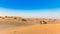 Sunset over sand dunes in Dubai Desert Conservation Reserve, United Arab Emirates. Copy space for text