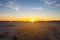 Sunset over a sandy prairie