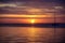 Sunset over sea with golden dramatic sky panorama. Calm sea with sunset sky. Ocean and sky background.