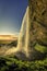 Sunset over Seljalandsfoss Waterfall in Iceland