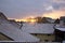 Sunset over snow covered rooftops